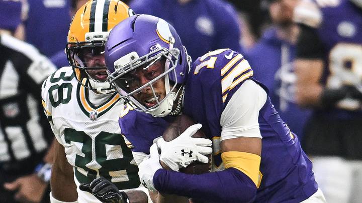 Minnesota Vikings receiver Justin Jefferson (18) catches a pass in front of Green Bay Packers defensive backJaylin Simpson. Minnesota Vikings receiver Justin Jefferson (18) catches a pass in front of Green Bay Packers defensive backJaylin Simpson.