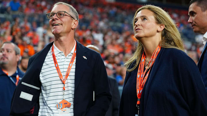 Aug 13, 2022; Denver, Colorado, USA; Denver Broncos CEO Greg Penner and wife Carrie Walton Penner before the game against the Dallas Cowboys at Empower Field at Mile High. Mandatory Credit: Ron Chenoy-Imagn Images