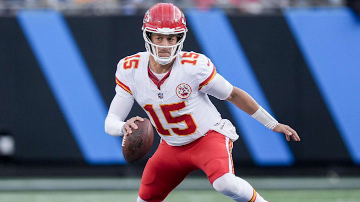 Nov 24, 2024; Charlotte, North Carolina, USA; Kansas City Chiefs quarterback Patrick Mahomes (15) scrambles in the backfield against the Carolina Panthers during the second half at Bank of America Stadium. Mandatory Credit: Jim Dedmon-Imagn Images