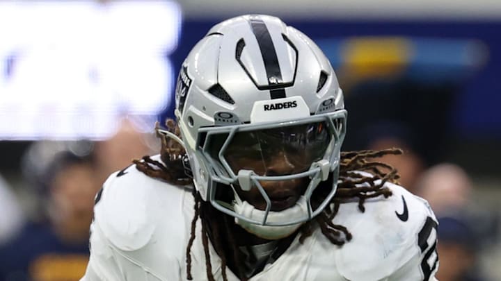 Nov 30, 2025; Inglewood, California, USA; Las Vegas Raiders running back Ashton Jeanty (2) rushes the ball against the Los Angeles Chargers during the second half at SoFi Stadium. Mandatory Credit: Kiyoshi Mio-Imagn Images
