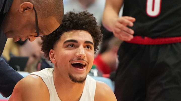 Feb 23, 2026; Chapel Hill, North Carolina, USA; North Carolina Tar Heels head coach Hubert Davis with guard Derek Dixon (3) in the second half at Dean E. Smith Center. Mandatory Credit: Bob Donnan-Imagn Images