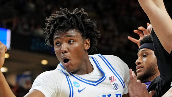 Mar 21, 2026; Greenville, SC, USA; Duke Blue Devils center Patrick Ngongba (21) loses the ball against Texas Christian University Horned Frogs forward David Punch (15) during the second half during a second round game of the men's 2026 NCAA Tournament at Bon Secours Wellness Arena. Mandatory Credit: Bob Donnan-Imagn Images