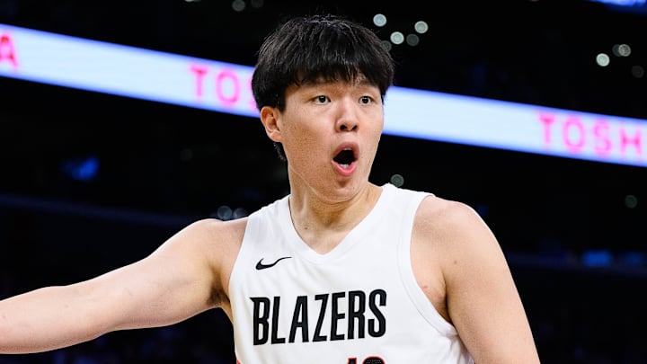 Oct 27, 2025; Los Angeles, California, USA; Portland Trail Blazers center Yang Hansen (16) reacts during the first half against the Los Angeles Lakers at Crypto.com Arena. Mandatory Credit: William Liang-Imagn Images