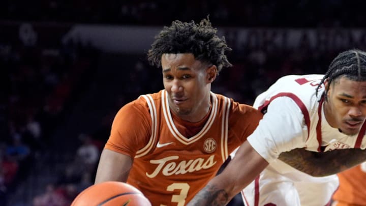 Oklahoma's Jeff Nwankwo (3) and Texas' Dailyn Swain (3) scramble for a loose ball in the second half of the men's college basketball game between the Oklahoma Sooners and the Texas Longhorns at Lloyd Noble Center in Norman, Okla., Saturday Jan. 31, 2026.