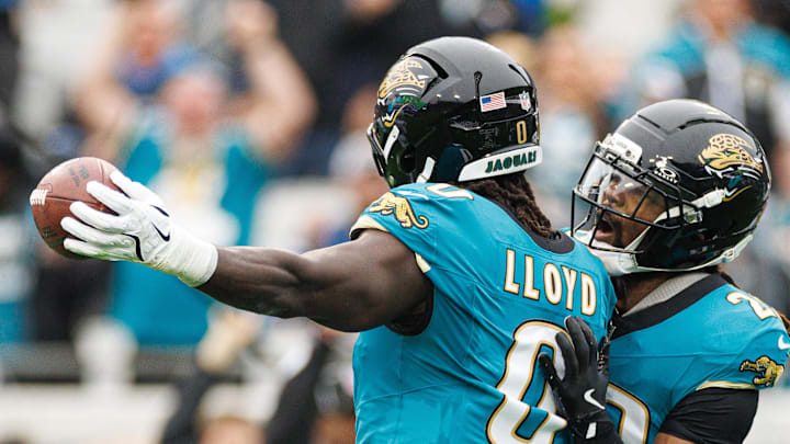 Dec 7, 2025; Jacksonville, Florida, USA; Jacksonville Jaguars linebacker Devin Lloyd (0) and Jacksonville Jaguars safety Eric Murray (29) celebrate after an interception against the Indianapolis Colts during the first half at EverBank Stadium. Mandatory Credit: Matt Pendleton-Imagn Images