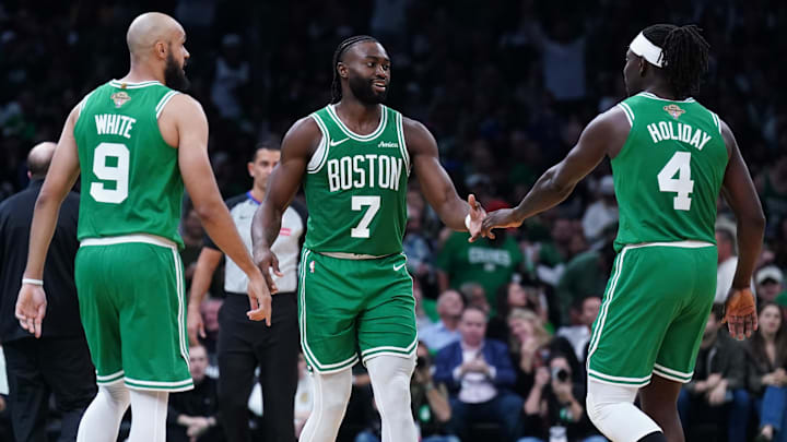 Oct 22, 2024; Boston, Massachusetts, USA; Boston Celtics guard Jaylen Brown (7), guard Jrue Holiday (4) and guard Derrick White (9) react after a play against the New York Knicks in the second half at TD Garden. Mandatory Credit: David Butler II-Imagn Images