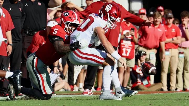 Oklahoma quarterback John Mateer gets the ball stripped during the first half against Georgia at Sanford Stadium. Oklahoma quarterback John Mateer gets the ball stripped during the first half against Georgia at Sanford Stadium.