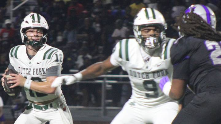 Dutch Fork quarterback Jaxon Knotts rolls out of the pocket against Ridge View. Dutch Fork quarterback Jaxon Knotts rolls out of the pocket against Ridge View.