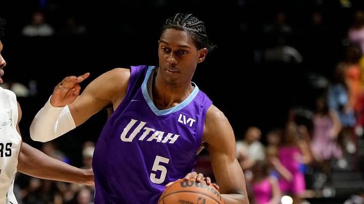 Jul 14, 2025; Las Vegas, NV, USA; Utah Jazz forward Cody Williams (5) drives the ball against San Antonio Spurs guard Harrison Ingram (55) during the first half of a NBA basketball game at the Thomas & Mack Center. Mandatory Credit: Lucas Peltier-Imagn Images Jul 14, 2025; Las Vegas, NV, USA; Utah Jazz forward Cody Williams (5) drives the ball against San Antonio Spurs guard Harrison Ingram (55) during the first half of a NBA basketball game at the Thomas & Mack Center. Mandatory Credit: Lucas Peltier-Imagn Images