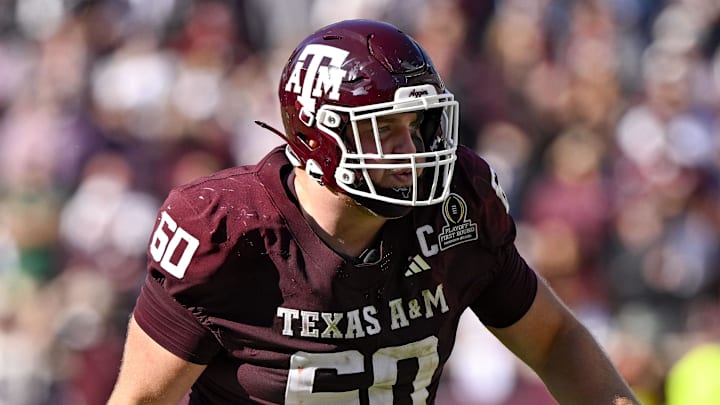 Dec 20, 2025; College Station, TX, USA; Texas A&M Aggies offensive lineman Trey Zuhn III (60) blocks the rush during the game between the Aggies and the Hurricanes at Kyle Field. Mandatory Credit: Jerome Miron-Imagn Images
