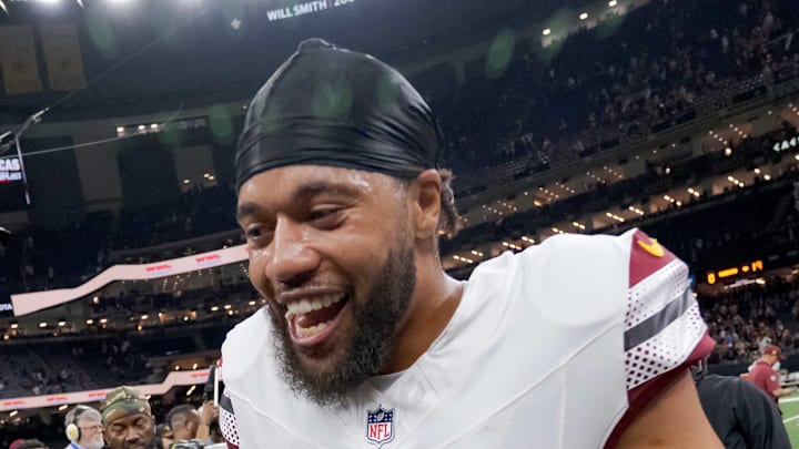 New Orleans Saints linebacker Demario Davis greets former teammate Washington Commanders cornerback Marshon Lattimore.