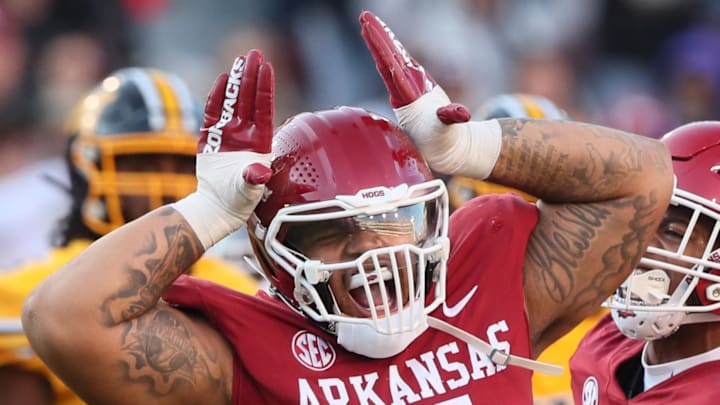 Former Arkansas Razorbacks defensive lineman Cameron Ball celebrates