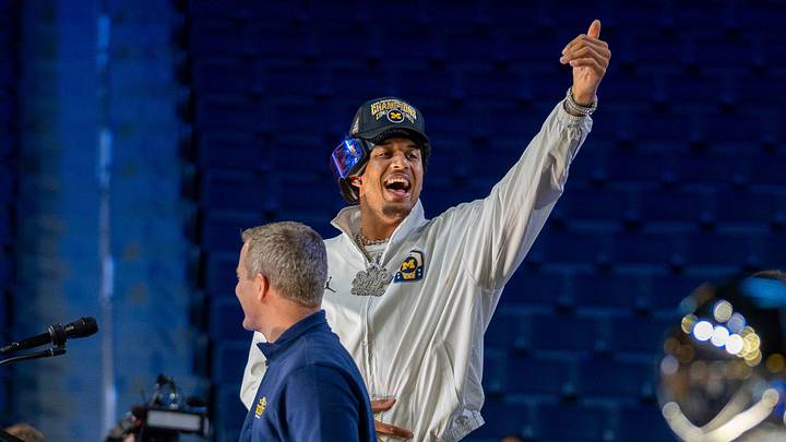 Michigan Wolverines player Yaxel Lendeborg stands next to head coach Dusty May during a celebration honoring the team’s NCAA men’s basketball national championship at Crisler Center in Ann Arbor on Saturday, April 11, 2026. Michigan Wolverines player Yaxel Lendeborg stands next to head coach Dusty May during a celebration honoring the team’s NCAA men’s basketball national championship at Crisler Center in Ann Arbor on Saturday, April 11, 2026.