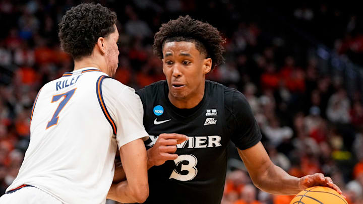 Xavier Musketeers guard Dailyn Swain (3) drives against Illinois Fighting Illini forward Will Riley (7) in the second half of the NCAA Tournament First Round game between the Illinois Fighting Illini and the Xavier Musketeers at Fiserv Forum in Milwaukee on Friday, March 21, 2025. Xavier was eliminated from the tournament, losing 86-73, to Illinois.