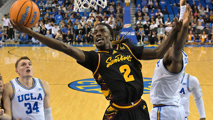 Dec 17, 2025; Los Angeles, California, USA;  Arizona State Sun Devils guard Anthony Johnson (2) drives past UCLA Bruins guard Eric Dailey Jr. (3) for a basket in the second half at Pauley Pavilion presented by Wescom Financial. Mandatory Credit: Jayne Kamin-Oncea-Imagn Images 