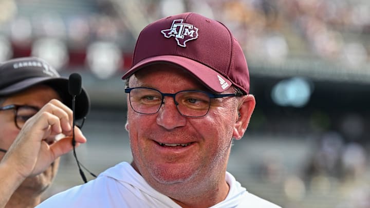 Texas A&M Aggies head coach Mike Elko gets ready for a pre-game interview with the SEC Nation prior to the game against the Missouri Tigers at Kyle Field. Mandatory Credit: Maria Lysaker-Imagn Images. Texas A&M Aggies head coach Mike Elko gets ready for a pre-game interview with the SEC Nation prior to the game against the Missouri Tigers at Kyle Field. Mandatory Credit: Maria Lysaker-Imagn Images.