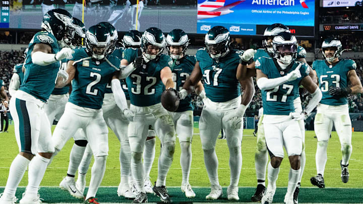 Nov 14, 2024; Philadelphia, Pennsylvania, USA; Philadelphia Eagles safety Reed Blankenship (32) celebrates with teammates after his interception during the fourth quarter against the Washington Commanders at Lincoln Financial Field. Mandatory Credit: Bill Streicher-Imagn Images