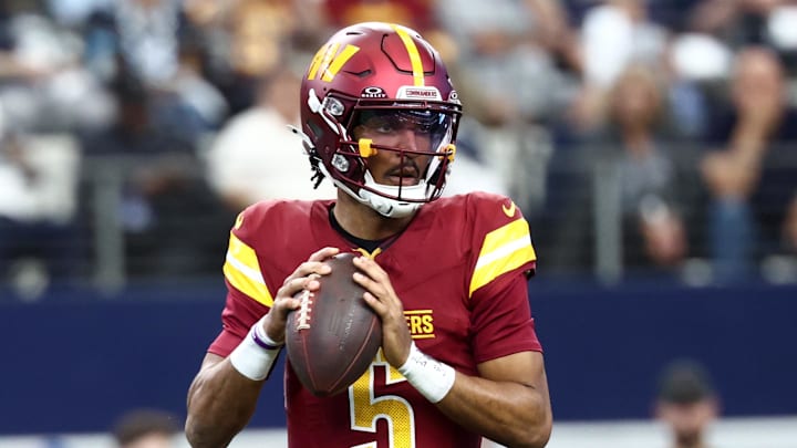 Oct 19, 2025; Arlington, Texas, USA; Washington Commanders quarterback Jayden Daniels (5) looks to pass the ball against the Dallas Cowboys during the first quarter of the game at AT&T Stadium. Mandatory Credit: Kevin Jairaj-Imagn Images Oct 19, 2025; Arlington, Texas, USA; Washington Commanders quarterback Jayden Daniels (5) looks to pass the ball against the Dallas Cowboys during the first quarter of the game at AT&T Stadium. Mandatory Credit: Kevin Jairaj-Imagn Images