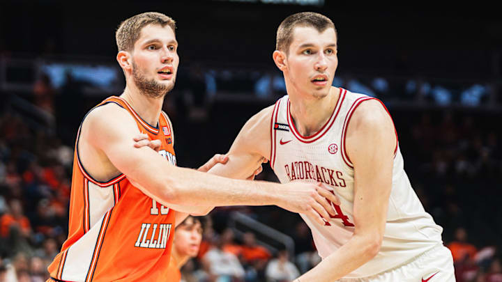Brothers Tomislav Ivisic (13) and Zvonimir Ivisic (44) battle inside in a game between Arkansas and Illinois. The Illini won 90-77.