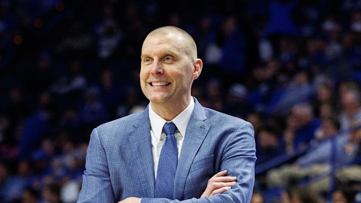 Feb 8, 2025; Lexington, Kentucky, USA; Kentucky Wildcats head coach Mark Pope smiles as he watches the action during the second half against the South Carolina Gamecocks at Rupp Arena at Central Bank Center. Mandatory Credit: Jordan Prather-Imagn Images