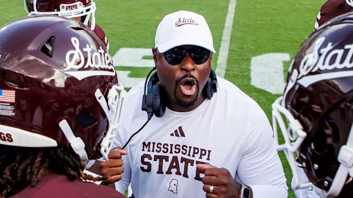 Mississippi State Bulldogs special teams coach Cliff Odom talks to his group on the sidelines during a game.