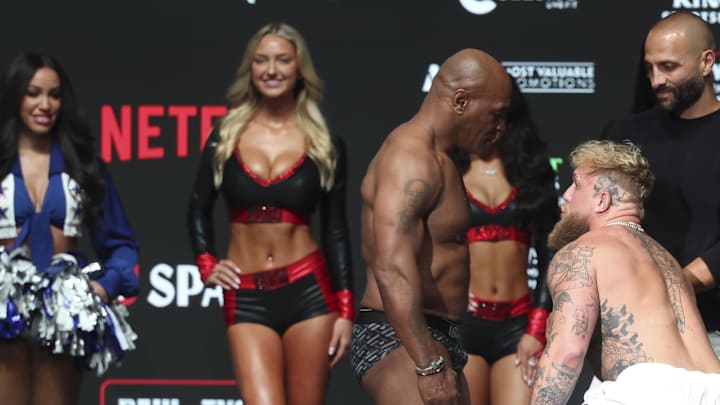 Jake Paul and Mike Tyson face off during weigh-ins at the Toyota Music Factory.