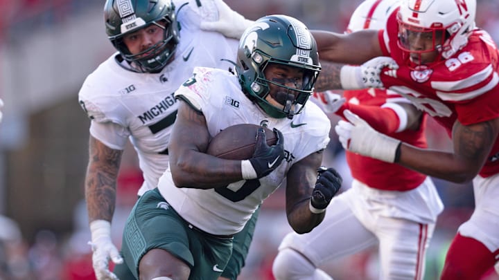 Oct 4, 2025; Lincoln, Nebraska, USA; Michigan State Spartans running back Makhi Frazier (5) runs with the ball during the game against Nebraska at Memorial Stadium. Oct 4, 2025; Lincoln, Nebraska, USA; Michigan State Spartans running back Makhi Frazier (5) runs with the ball during the game against Nebraska at Memorial Stadium.