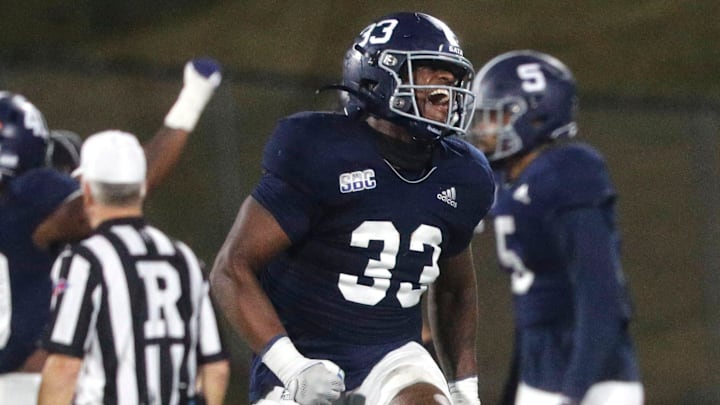 Georgia Southern linebacker Marques Watson-Trent leaps into the air as he celebrates a defensive stand during Saturday's game against Appalachian State.