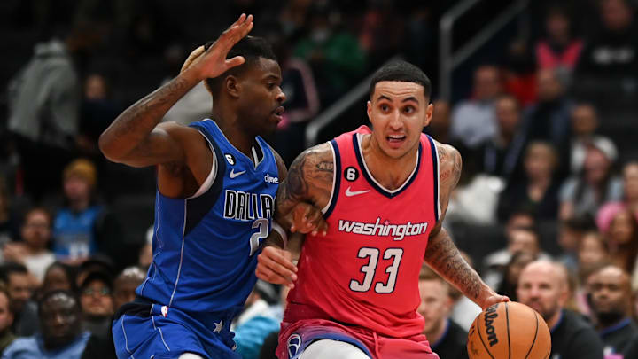 Nov 10, 2022; Washington, District of Columbia, USA; Washington Wizards forward Kyle Kuzma (33) makes a move to the basket on Dallas Mavericks forward Reggie Bullock (25) during the second half  at Capital One Arena. Mandatory Credit: Tommy Gilligan-Imagn Images