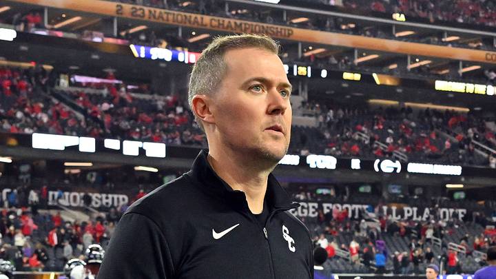 Southern California Trojans head coach Lincoln Riley walks the field before the CFP national championship game between the TCU Horned Frogs and the Georgia Bulldogs at SoFi Stadium.