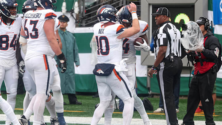 Sep 29, 2024; East Rutherford, New Jersey, USA; Denver Broncos wide receiver Courtland Sutton (14) celebrates a touchdown reception with quarterback Bo Nix (10) during the second half against the New York Jets at MetLife Stadium.