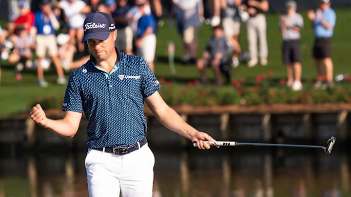 Justin Thomas made his 11th birdie at the 17th hole en route to a course-record-tying 62 Friday at TPC Sawgrass.
