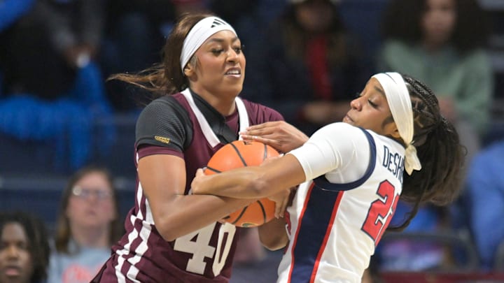 Mississippi State's Madison Francis (40) and Ole Miss guard Denim DeShields (22) battle for the ball during a women's college basketball game between Ole Miss and Mississippi State at the Sandy and John Black Pavilion in Oxford, Miss. on Sunday, Jan. 11, 2026.