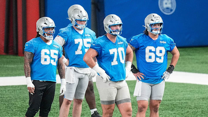 Detroit Lions offensive tackle Dan Skipper (70), center left, and guard Tate Ratledge (69).