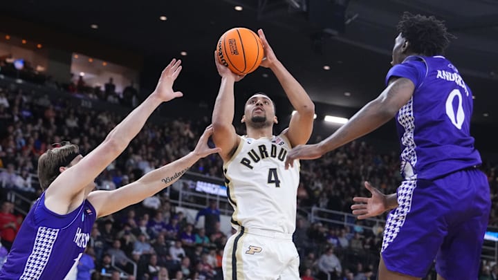 Purdue forward Trey Kaufman-Renn (4) shoots over two High Point defenders during their NCAA Tournament game on Thursday.