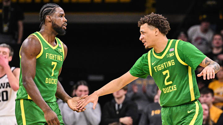 Feb 19, 2025; Iowa City, Iowa, USA; Oregon Ducks guard Jadrian Tracey (2) and forward Supreme Cook (7) react during the second half against the Iowa Hawkeyes at Carver-Hawkeye Arena. Mandatory Credit: Jeffrey Becker-Imagn Images
