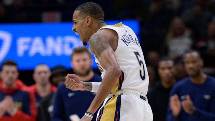 Jan 15, 2025; New Orleans, Louisiana, USA; New Orleans Pelicans guard Dejounte Murray (5) reacts after making a basket late in the fourth quarter against the Dallas Mavericks at Smoothie King Center. Mandatory Credit: Matthew Hinton-Imagn Images
