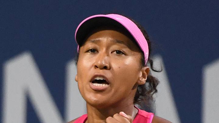 Naomi Osaka reacts after a point