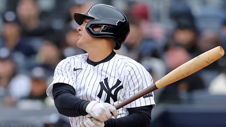 Mar 30, 2025; Bronx, New York, USA; New York Yankees shortstop Anthony Volpe (11) follows through on a swing using a torpedo bat during the first inning against the Milwaukee Brewers at Yankee Stadium. 