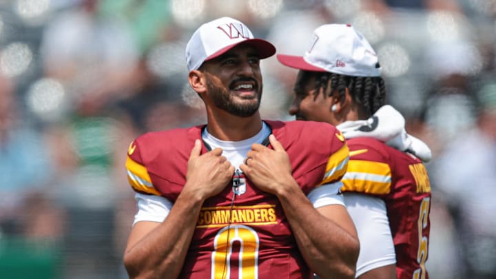 Washington Commanders quarterback Marcus Mariota (0).