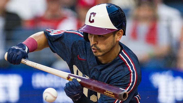Cleveland Guardians center fielder Steven Kwan (38) hits a sacrifice bunt
