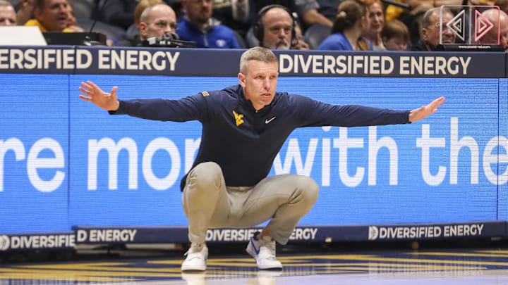 Feb 28, 2026; Morgantown, West Virginia, USA; West Virginia Mountaineers head coach Ross Hodge watched a play from the sideline during the first half against the BYU Cougars at Hope Coliseum. 