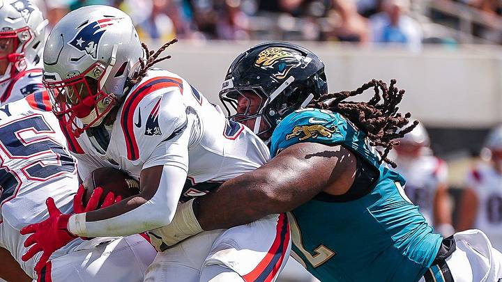 Jacksonville Jaguars defensive tackle Davon Hamilton (52) denies New England Patriots running back Rhamondre Stevenson (38) a touchdown in the second quarter during an NFL football game at EverBank Stadium, Sunday, September 27, 2026, in Jacksonville, Fla. 