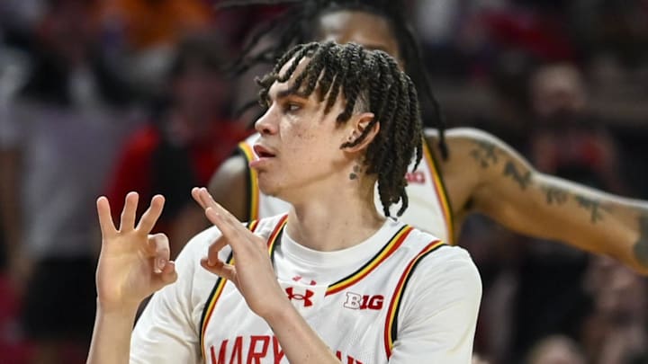 Mar 8, 2026; College Park, Maryland, USA;  Maryland Terrapins guard Darius Adams (1) celebrates with the bench after making a 3- point basket during the second half against the Illinois Fighting Illini at Xfinity Center. Mandatory Credit: Tommy Gilligan-Imagn Images