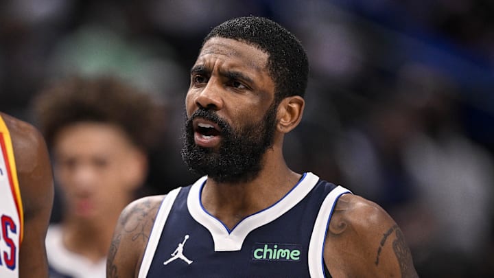 Feb 12, 2025; Dallas, Texas, USA; Golden State Warriors forward Jimmy Butler (10) and Dallas Mavericks guard Kyrie Irving (11) during the game between the Dallas Mavericks and the Golden State Warriors at the American Airlines Center. Mandatory Credit: Jerome Miron-Imagn Images