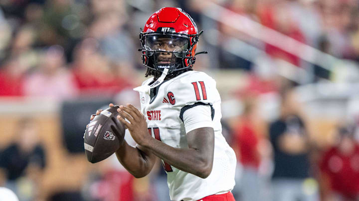Sep 11, 2025; Winston-Salem, North Carolina, USA;  North Carolina State Wolfpack quarterback CJ Bailey (11) throws a pass in the first half against the Wake Forest Demon Deacons at Allegacy Federal Credit Union Stadium. Mandatory Credit: Luke Jamroz-Imagn Images