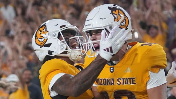 Arizona State quarterback Sam Leavitt (10) celebrates his touchdown run with teammate Jordyn Tyson (0) against the Mississippi State Bulldogs at Mountain America Stadium in Tempe on Sept. 7, 2024.