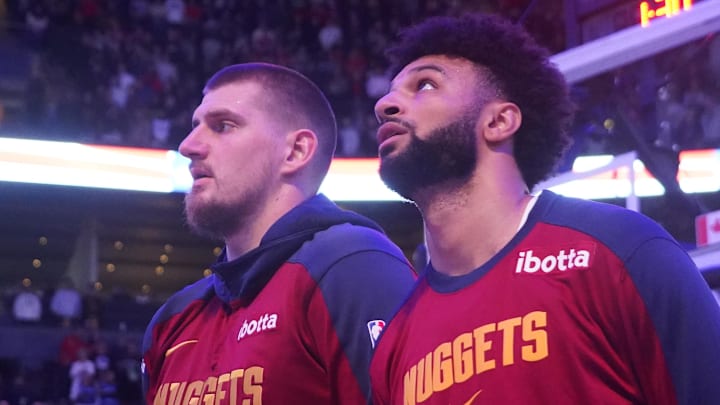 Oct 28, 2024; Toronto, Ontario, CAN; Denver Nuggets center Nikola Jokic (left) and guard Jamal Murray (right) during the anthems before a game against the Toronto Raptors at Scotiabank Arena.