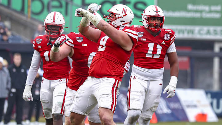 Nebraska defensive lineman Ty Robinson (9) celebrates a defensive stop during 2024 Pinstripe Bowl.