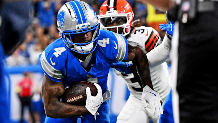 Sep 28, 2025; Detroit, Michigan, USA; Detroit Lions cornerback D.J. Reed (4) runs the ball during the first half against the Cleveland Browns at Ford Field. Sep 28, 2025; Detroit, Michigan, USA; Detroit Lions cornerback D.J. Reed (4) runs the ball during the first half against the Cleveland Browns at Ford Field.
